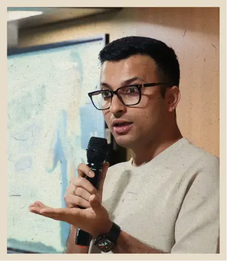 Aashish Solanki speaking to the batch at orientation week
